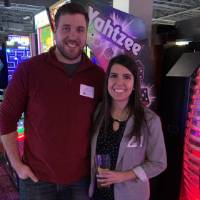 Two alumni smiling for picture